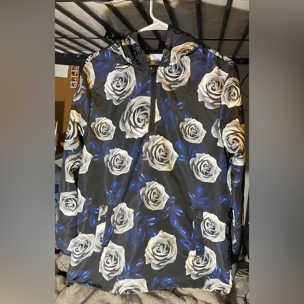 Hey this is a lightly worn jacket with roses from rue21.